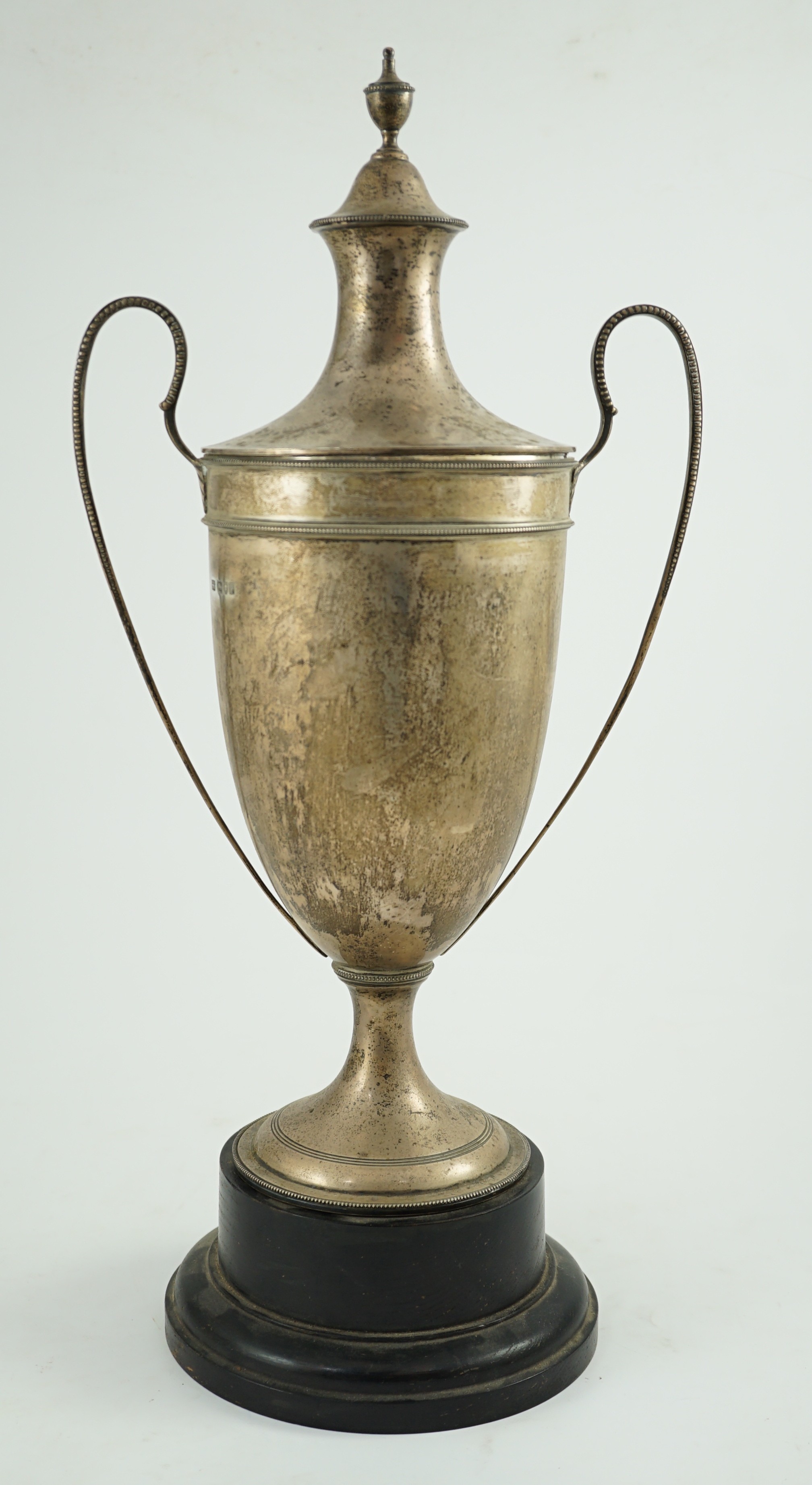 A George V silver two handled cup and cover by Sebastian Garrard